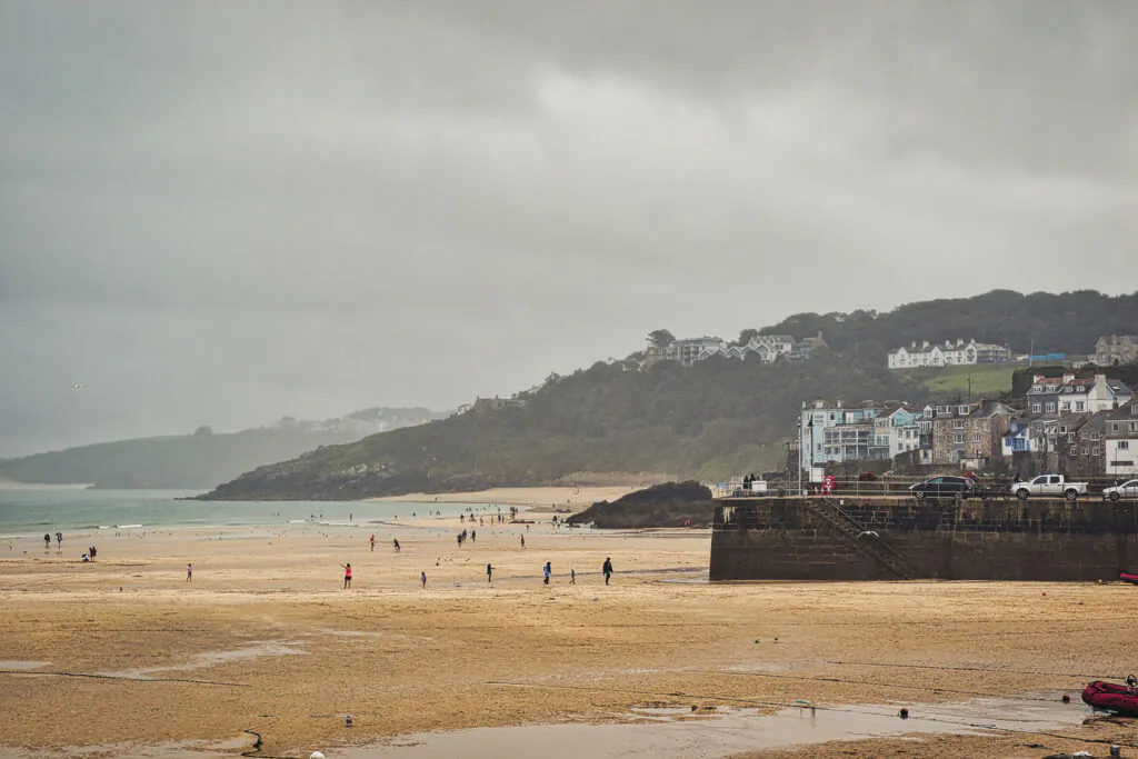 Coastal Beach Scene Under Cloudy Sky in St Ives, Cornwall, UK