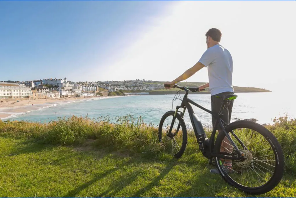 man-on-bike-overlooking-Porthmeor-Beach